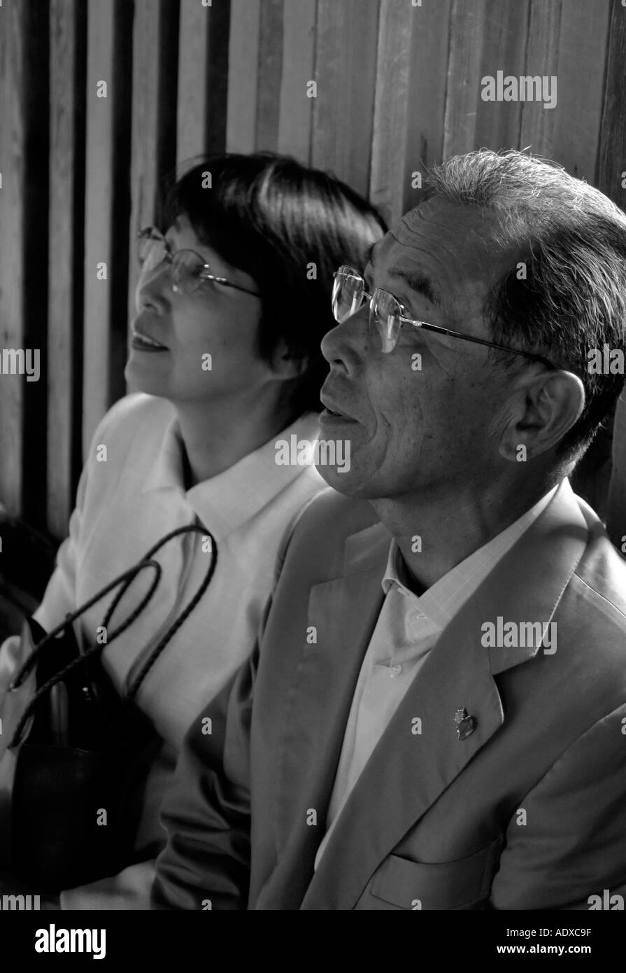 An old Japanese married couple gaze in reverance and awe Stock Photo