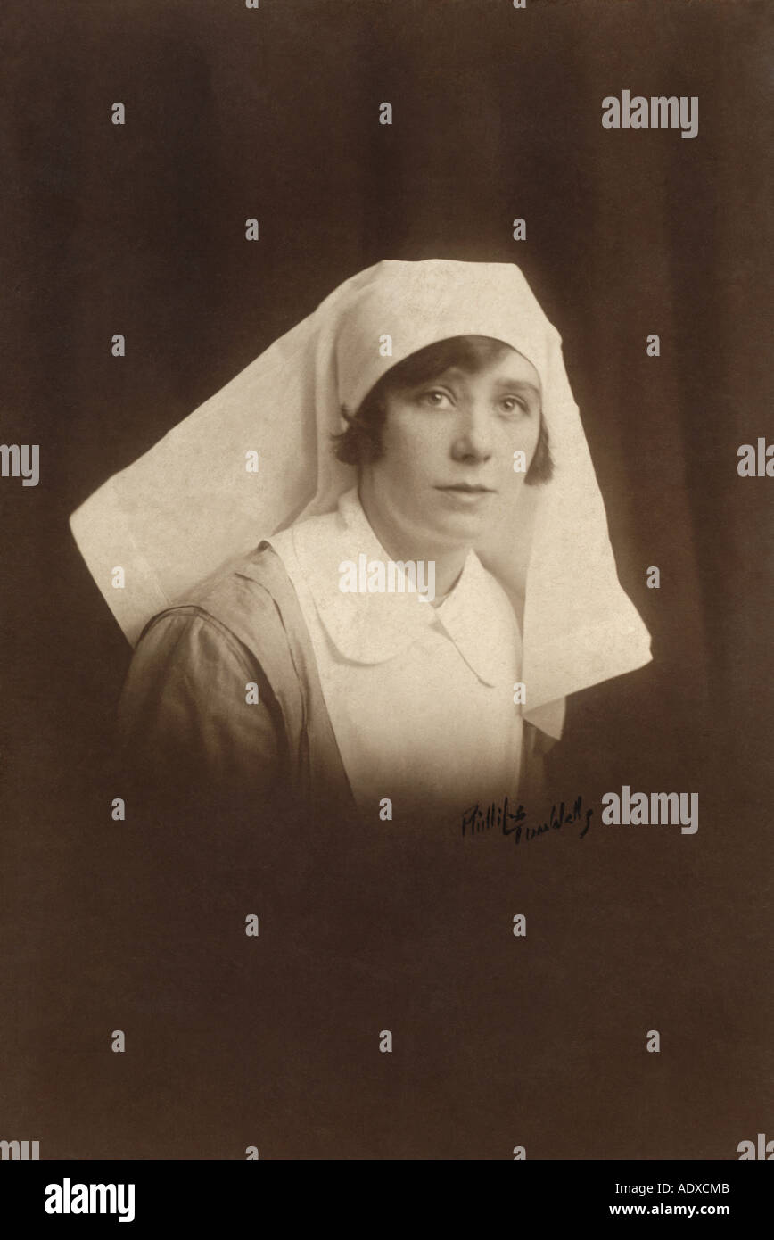 Original studio portrait photograph of pretty WW1 era nurse, Tunbridge Wells, Kent, England, U.K. Circa 1917 / 1918 Stock Photo