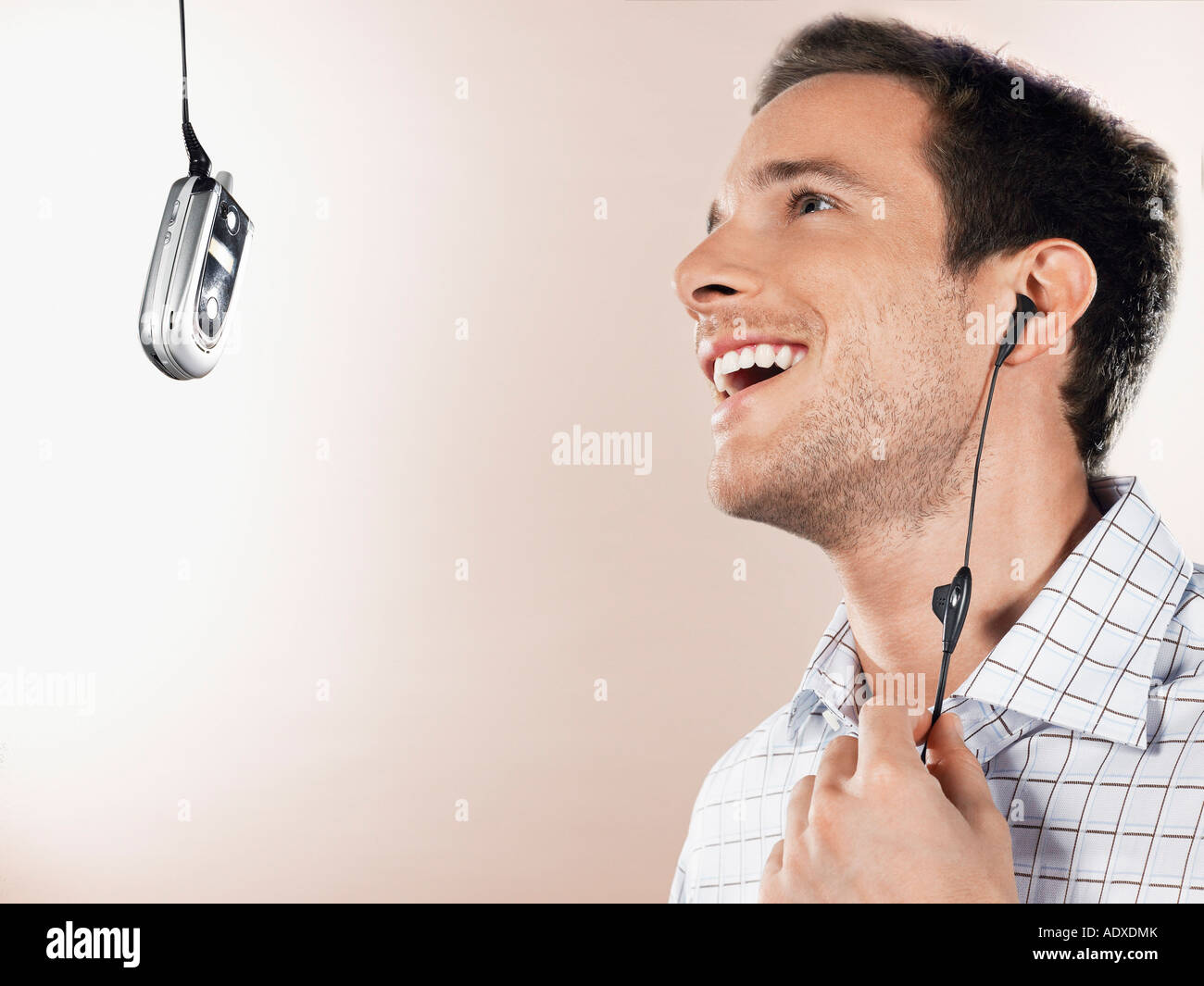 Man Listening to MP3 Cell Phone Stock Photo