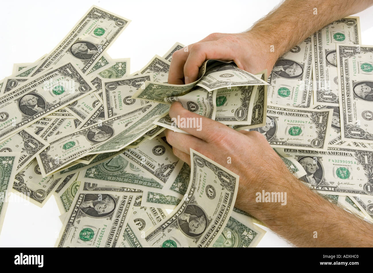 hands grab at money snatsch one dollar 1 notes currency covetousness avarice piggishness voracity greed cupidity ravenousness Stock Photo