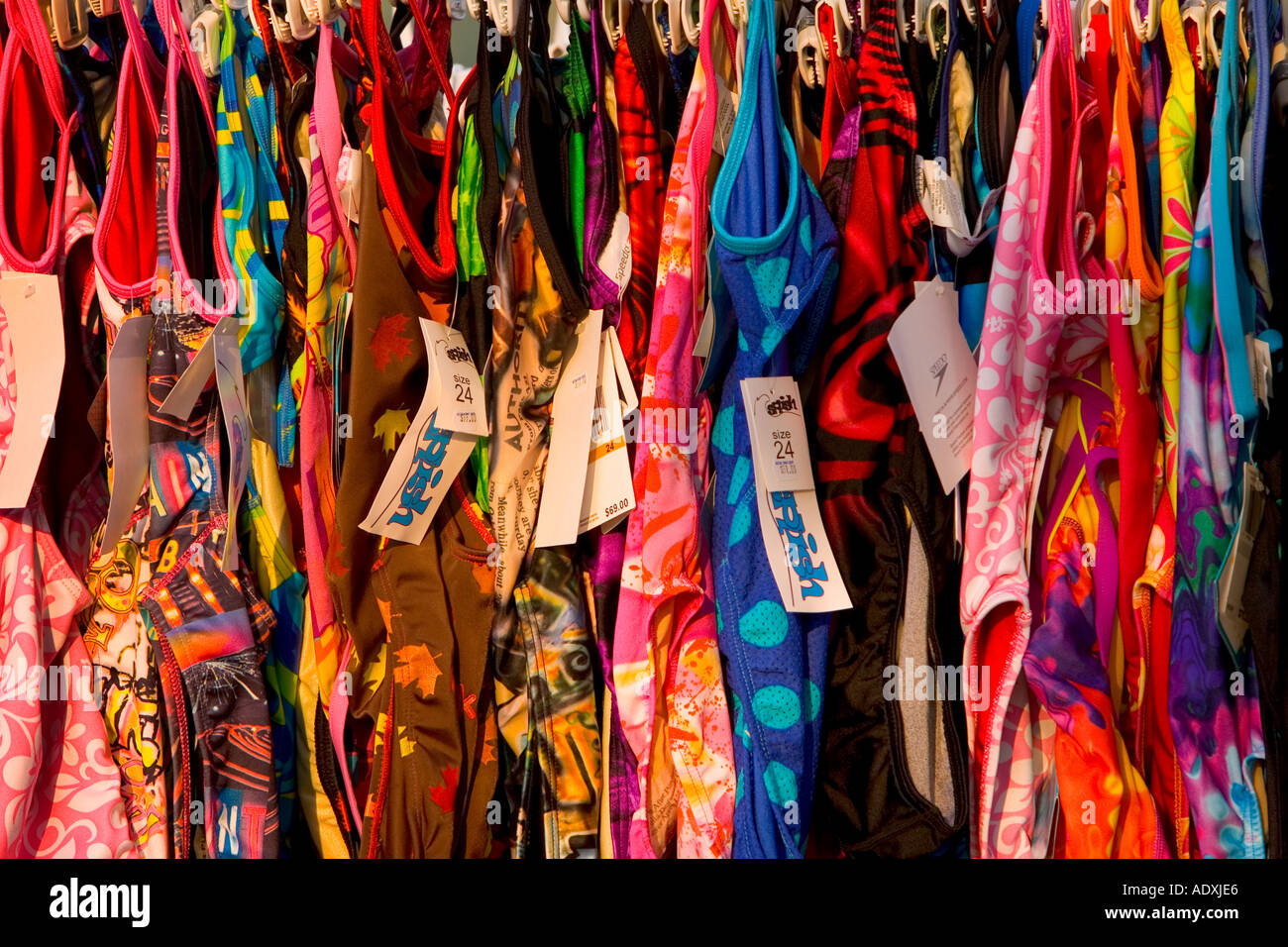 Bathing suits for sale on a clothing rack Stock Photo Alamy