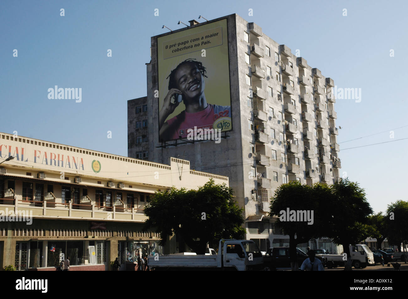 Billboard with young african man talking on a cell phone in central Nampula Mozambique Stock Photo