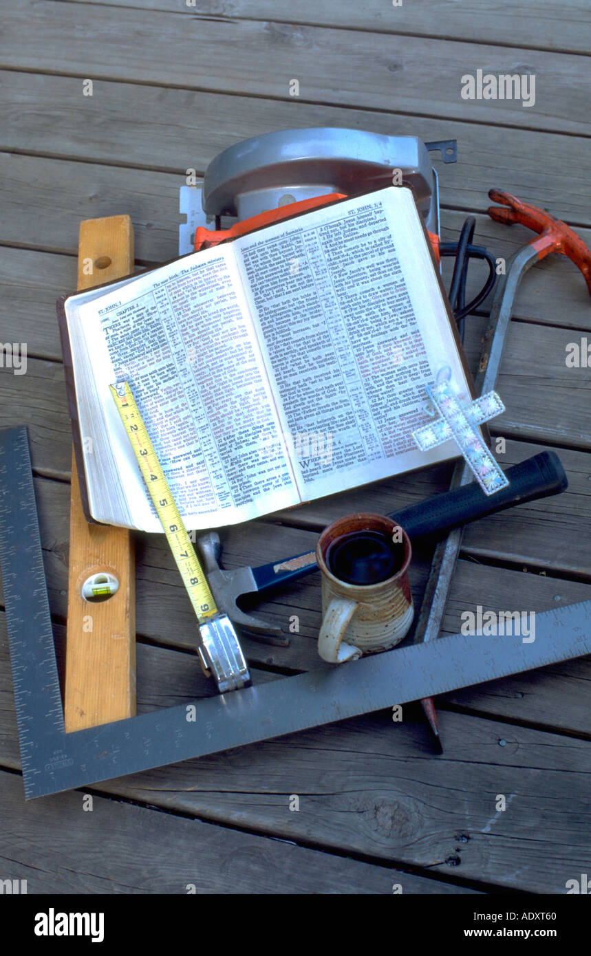 Carpenter's tools Bible cross mug level tape measurer hammer and saw