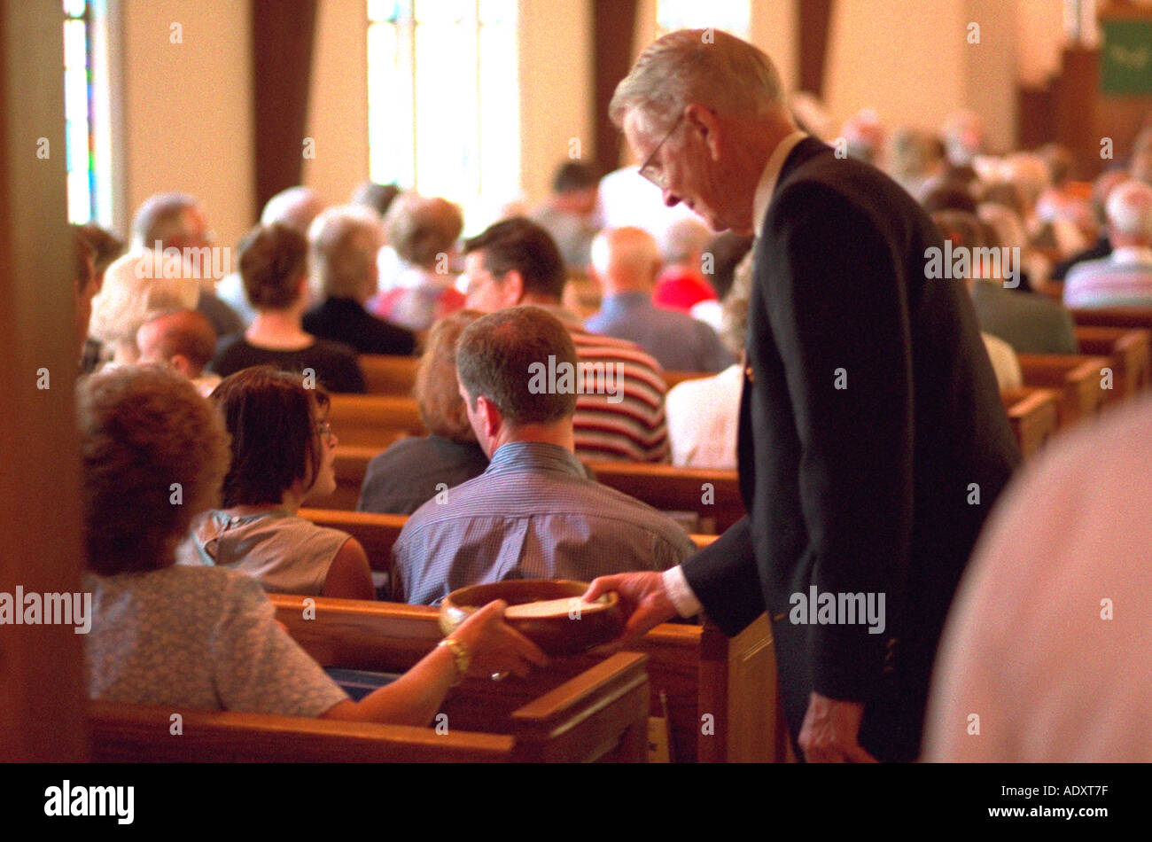 Usher collecting offering from church member. Western Springs Illinois