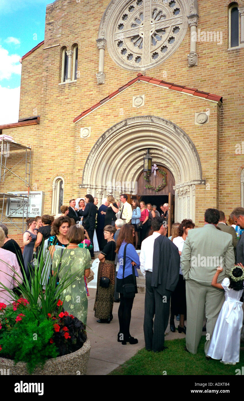 Guests greeting newlyweds outside Catholic church. St Paul Minnesota USA Stock Photo