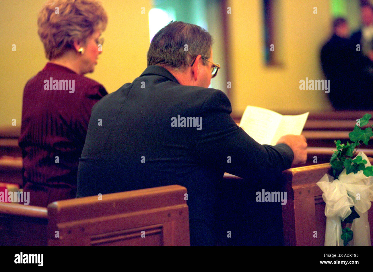 Couple singing at church during wedding service.  St Paul Minnesota USA Stock Photo