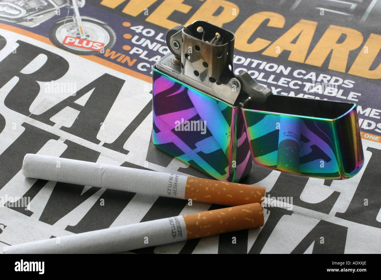 Old fashioned Zippo petrol cigarette lighter with cigarettes on