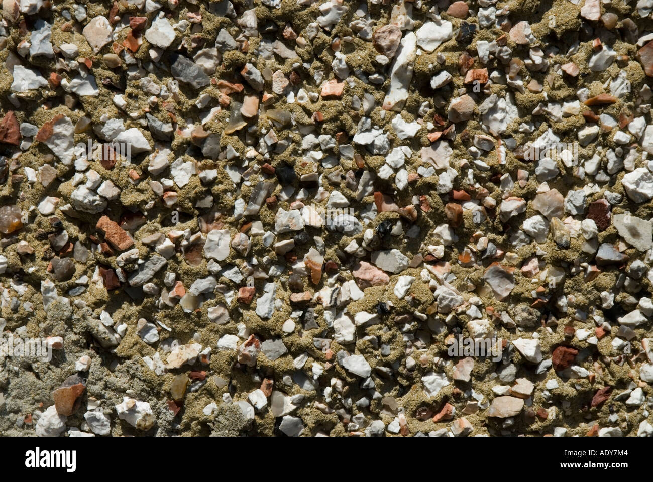 A section of pebbledashing used to render the exterior of a house Stock Photo