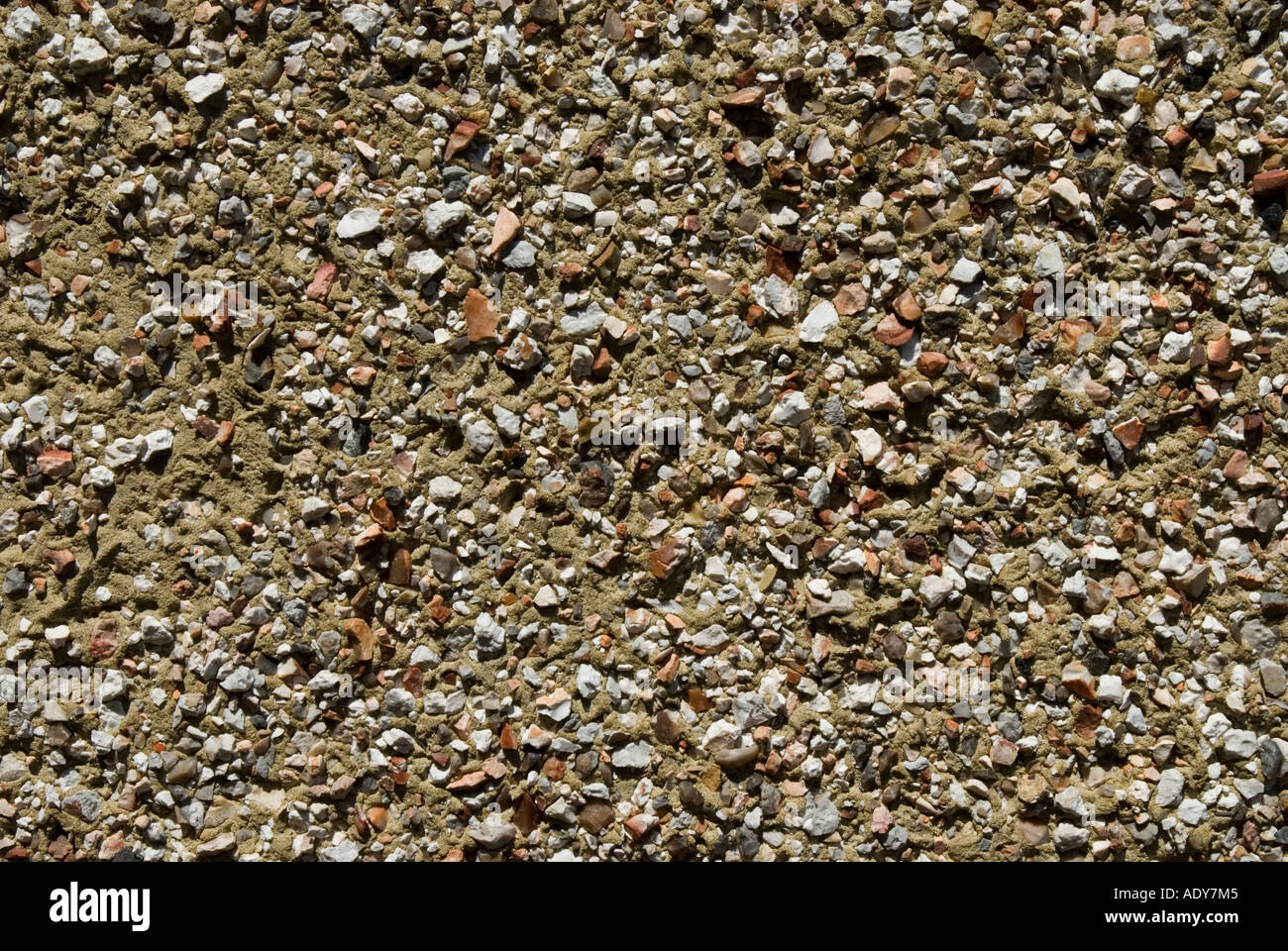 A section of pebbledashing used to render the exterior of a house Stock Photo