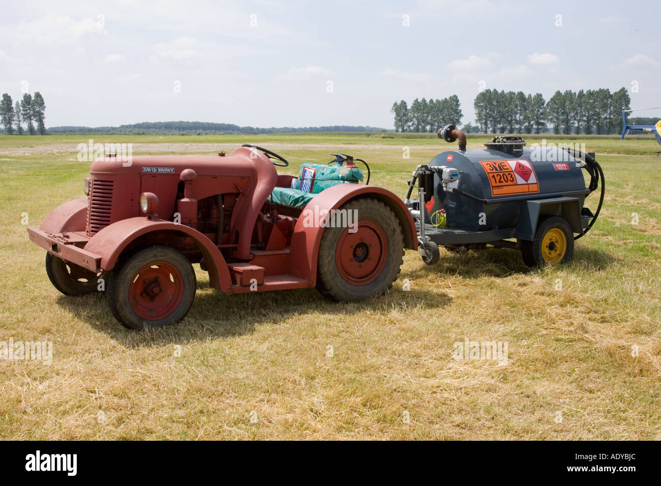 aviation fuel tanker / bowser and tractor at the airfield of  Rougham Fair in Suffolk in summer June 2006 Stock Photo