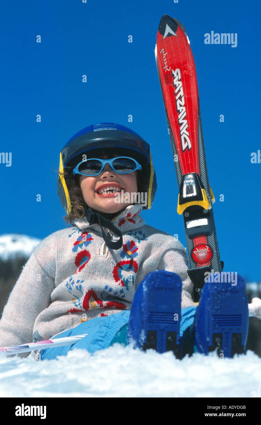 boy with ski in snow, wearing snow goggles and helmet Stock Photo Alamy