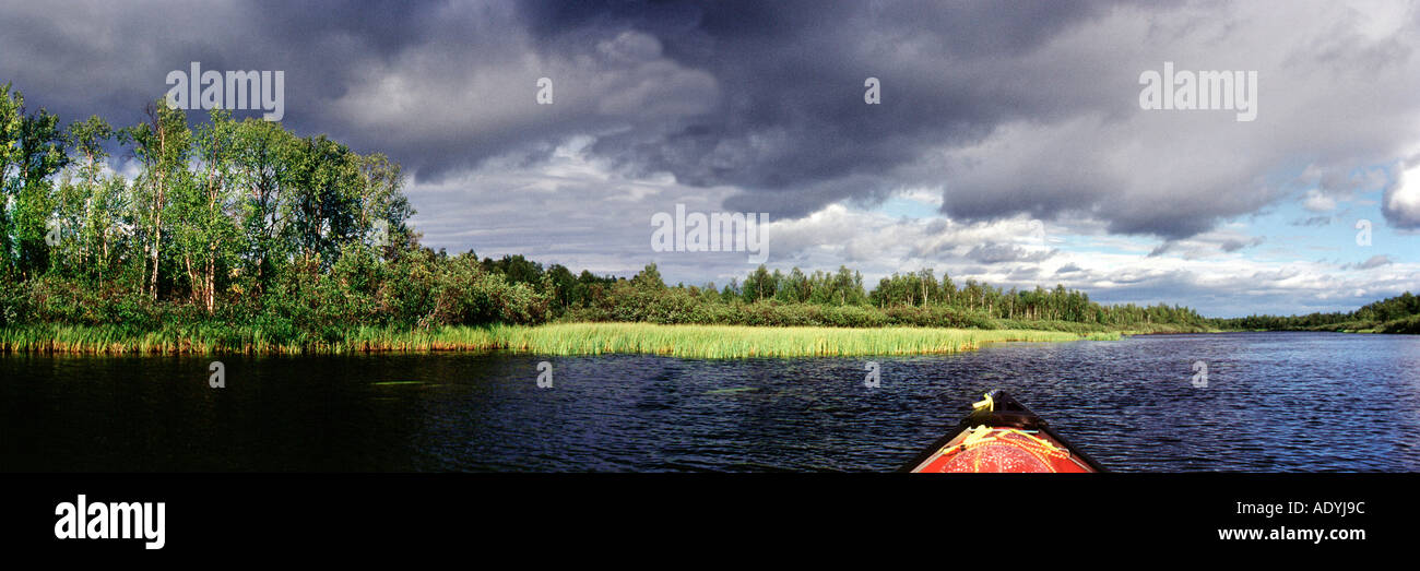 canoe tour on Ivalojoki, by sunshine and raising storm, Finland, Lapin, Lisma, Aug 03. Stock Photo