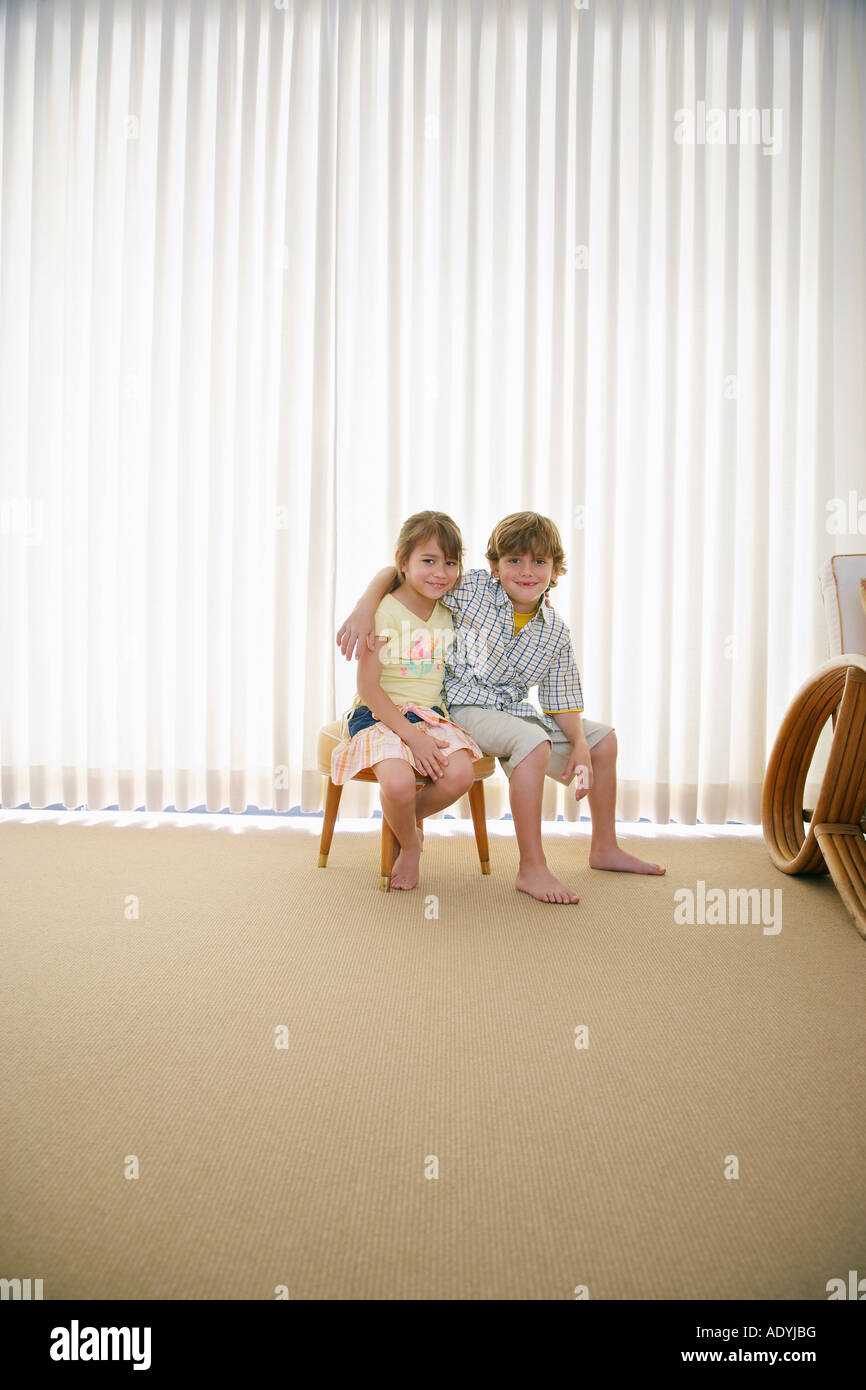 Boy sitting on stool hi-res stock photography and images - Alamy