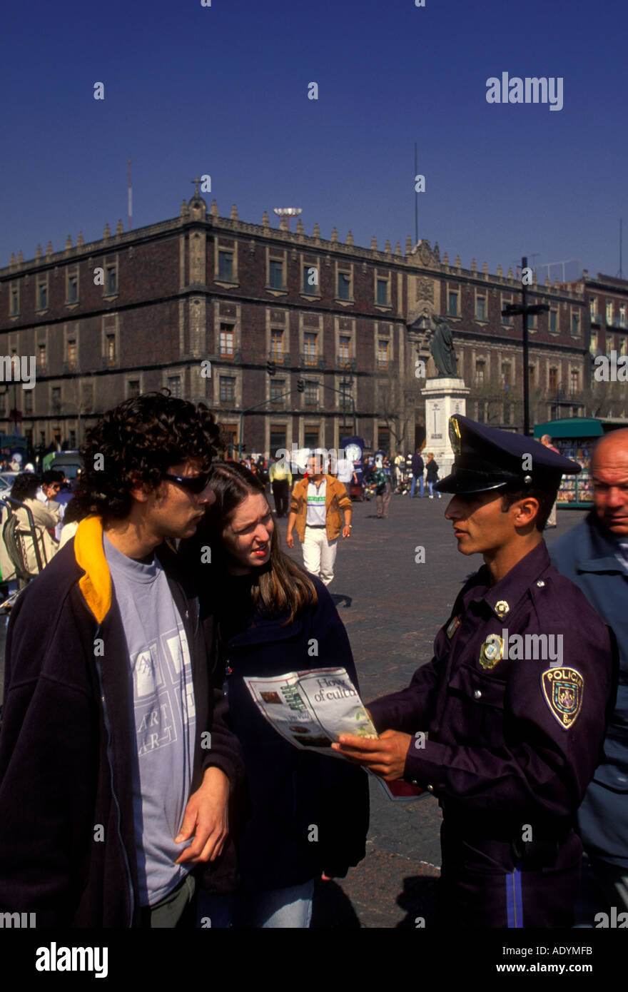 Mexican policeman, policeman assisting tourists, Zocalo, Mexico City, Federal District, Mexico Stock Photo