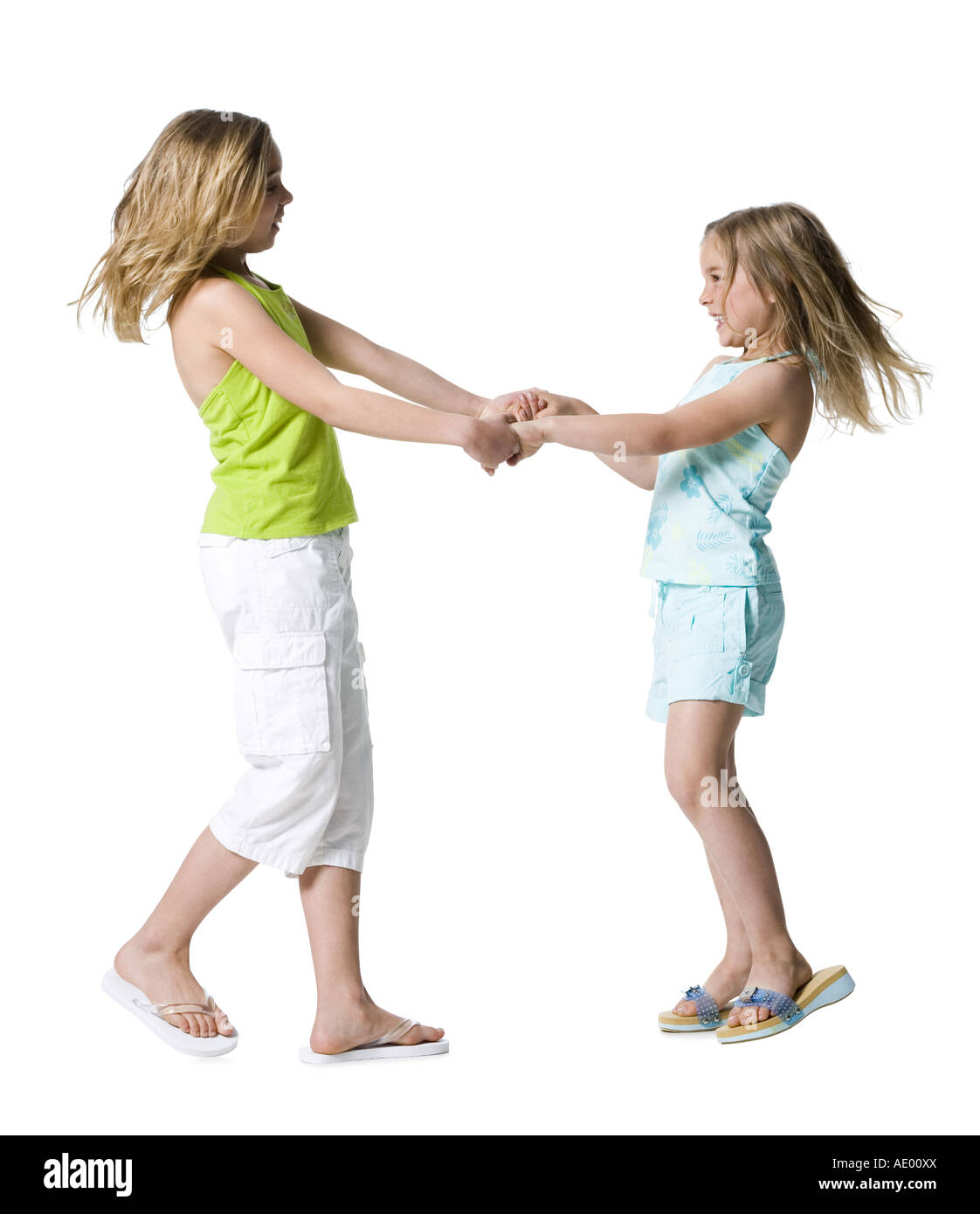 Girls dancing and holding hands Stock Photo