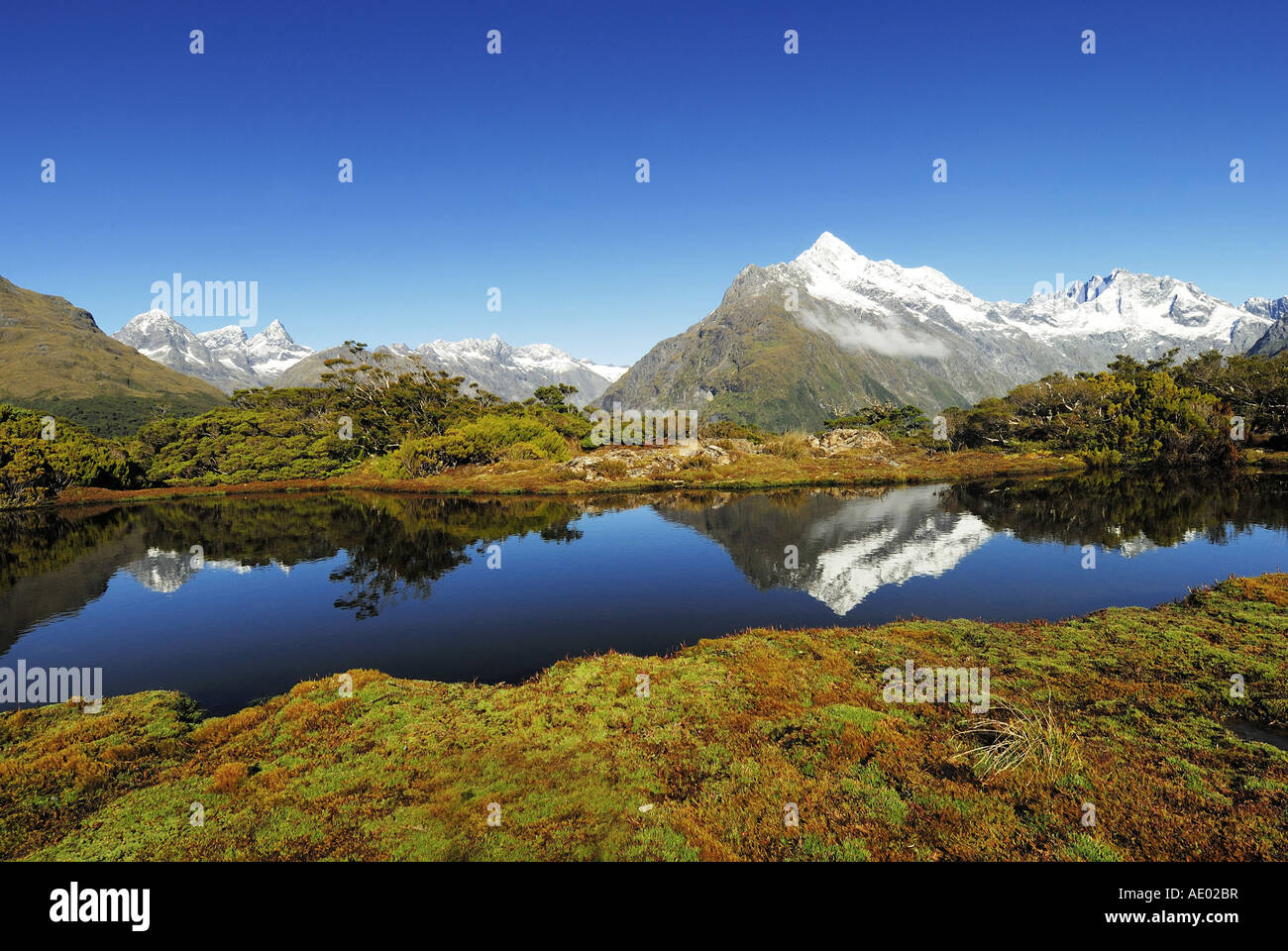 Key Summit with mirror image of Mt. Christina, New Zealand, Southern Island, Fjordland National Park Stock Photo