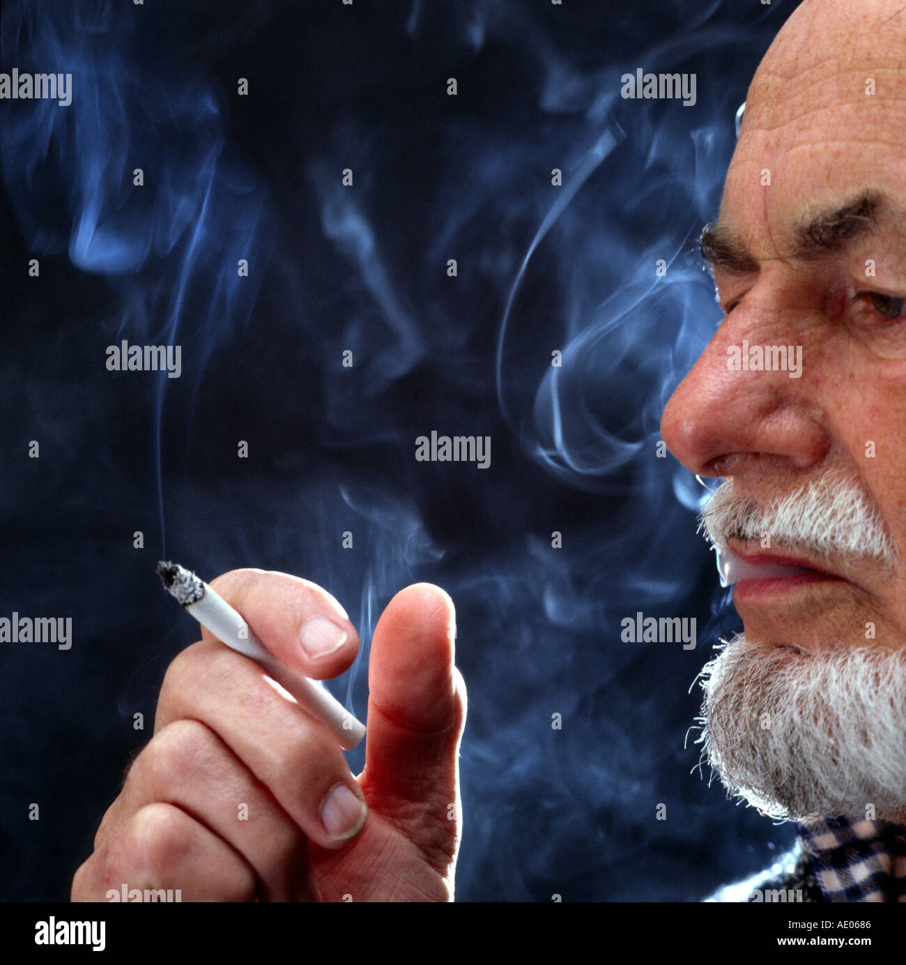 man smoking a cigarette Stock Photo