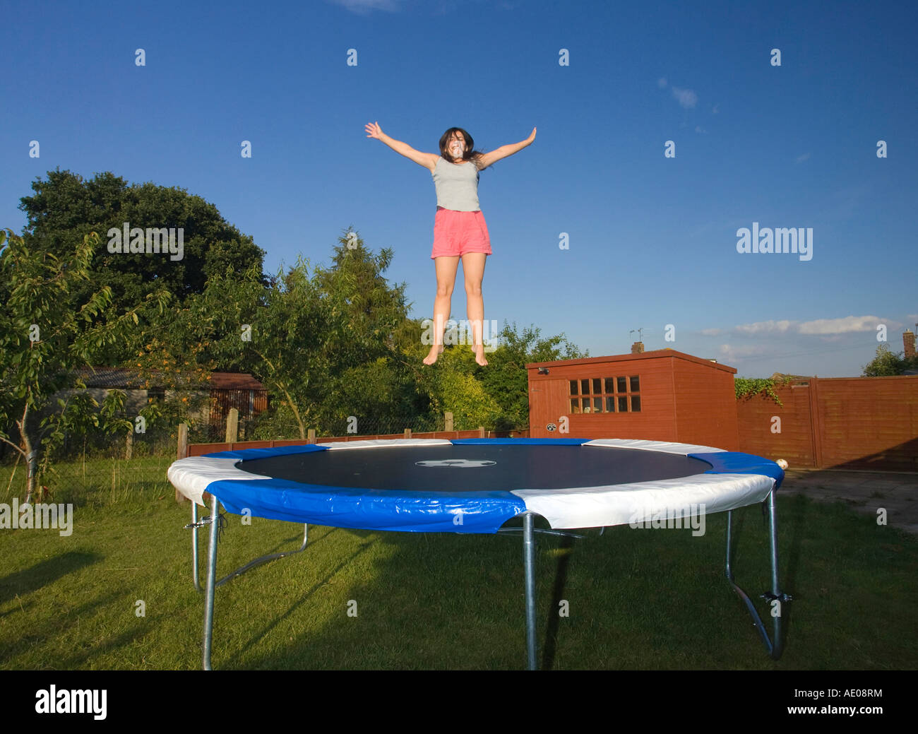 Woman Jumping On Trampoline Stock Photos & Woman Jumping On Trampoline
