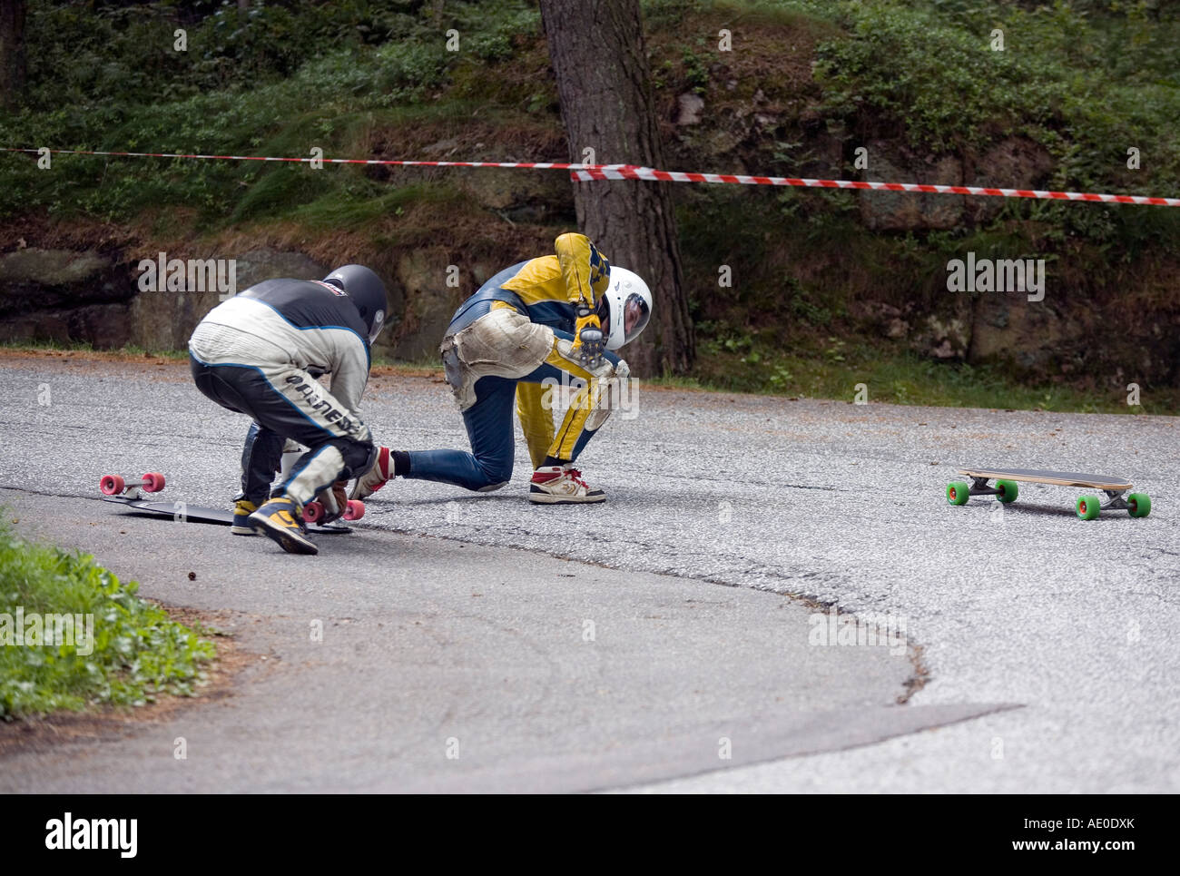 Two men in Longboard downhill Skateboard accident Stock Photo Alamy