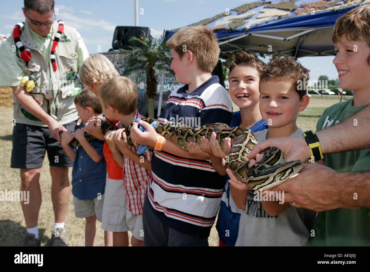 Valparaiso Indiana,Porter County Fair,python snake,boy boys,male kid kids child children youngster,trainers,IN070722034 Stock Photo