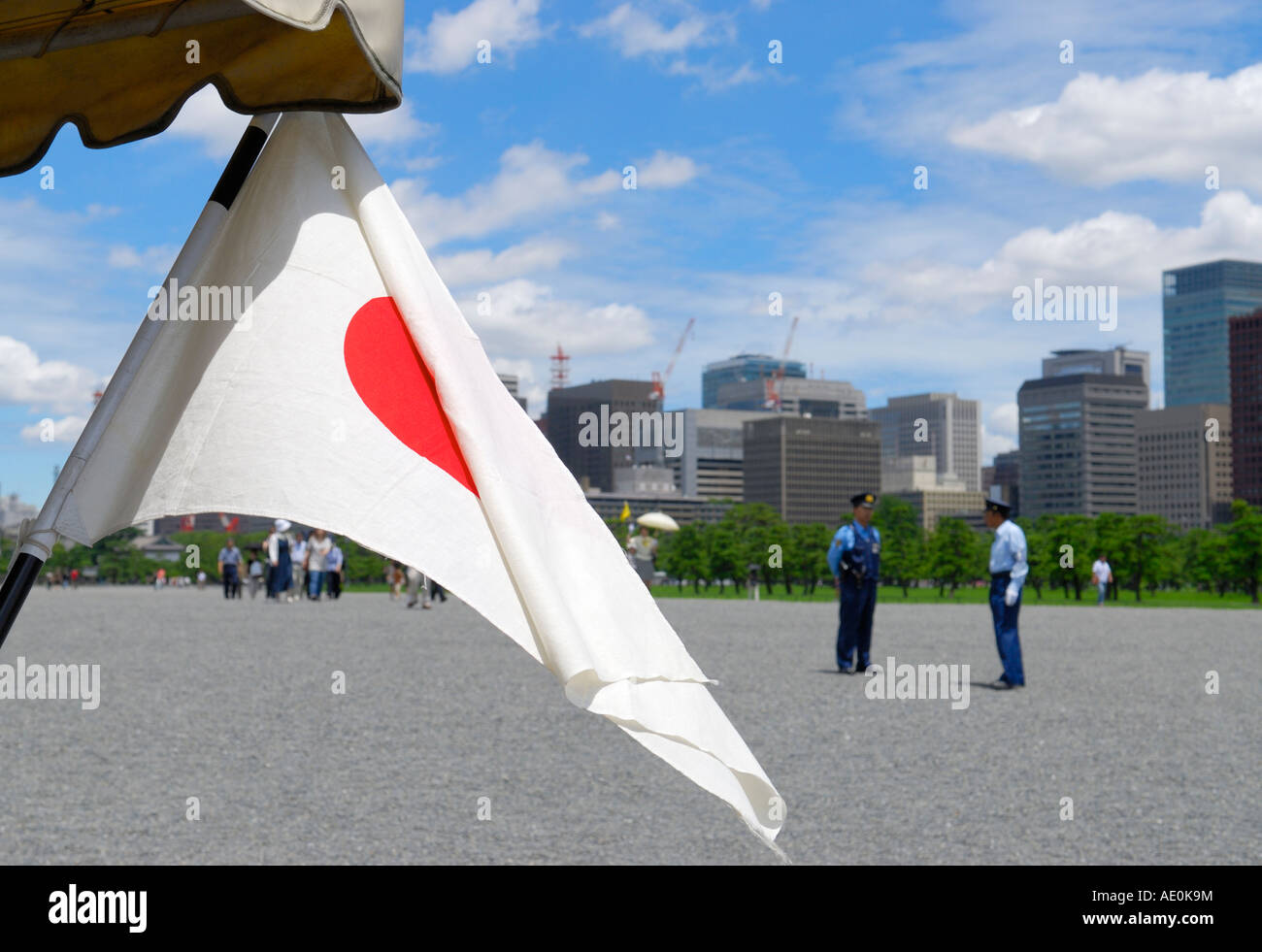 A japanese national flag with Marunouchi district in the background, Toyko, Japan Stock Photo
