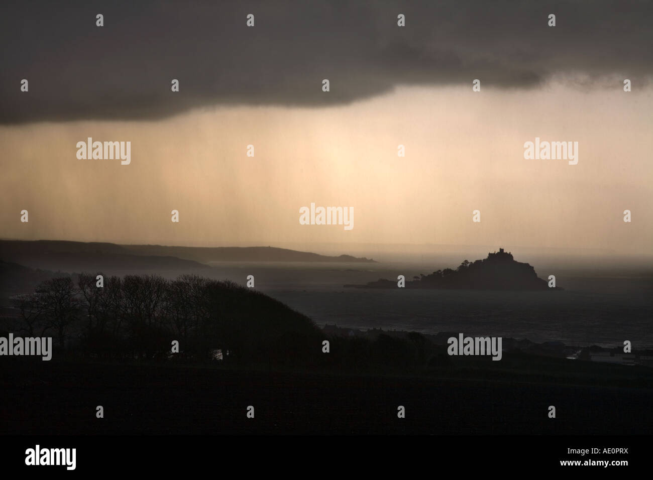 the view to st michael s mount from the village of gulval during a storm cornwall Stock Photo
