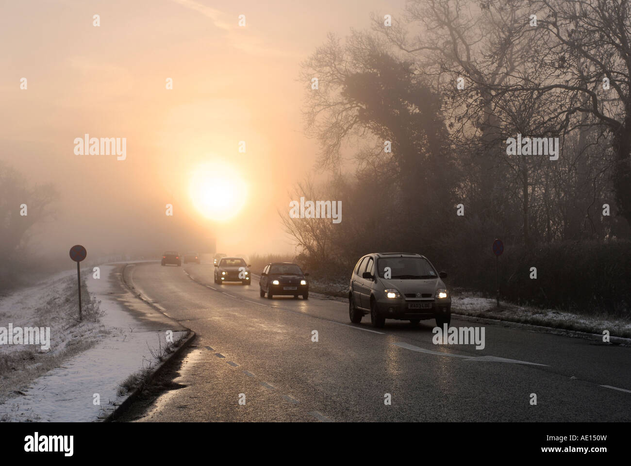 Cars being driven in foggy conditions on a road in the uk Stock Photo