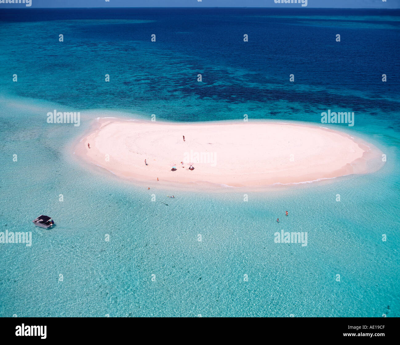 Aerial of tourists visiting coral sand cay on Great Barrier Reef