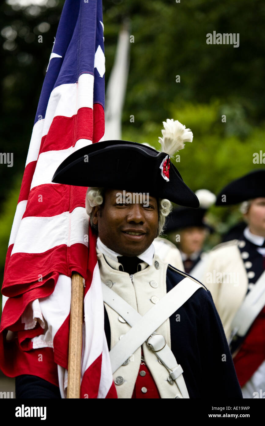 USA flag bearer in period military uniform (circa 1776) at the Edinburgh festival, Scotland. Stock Photo