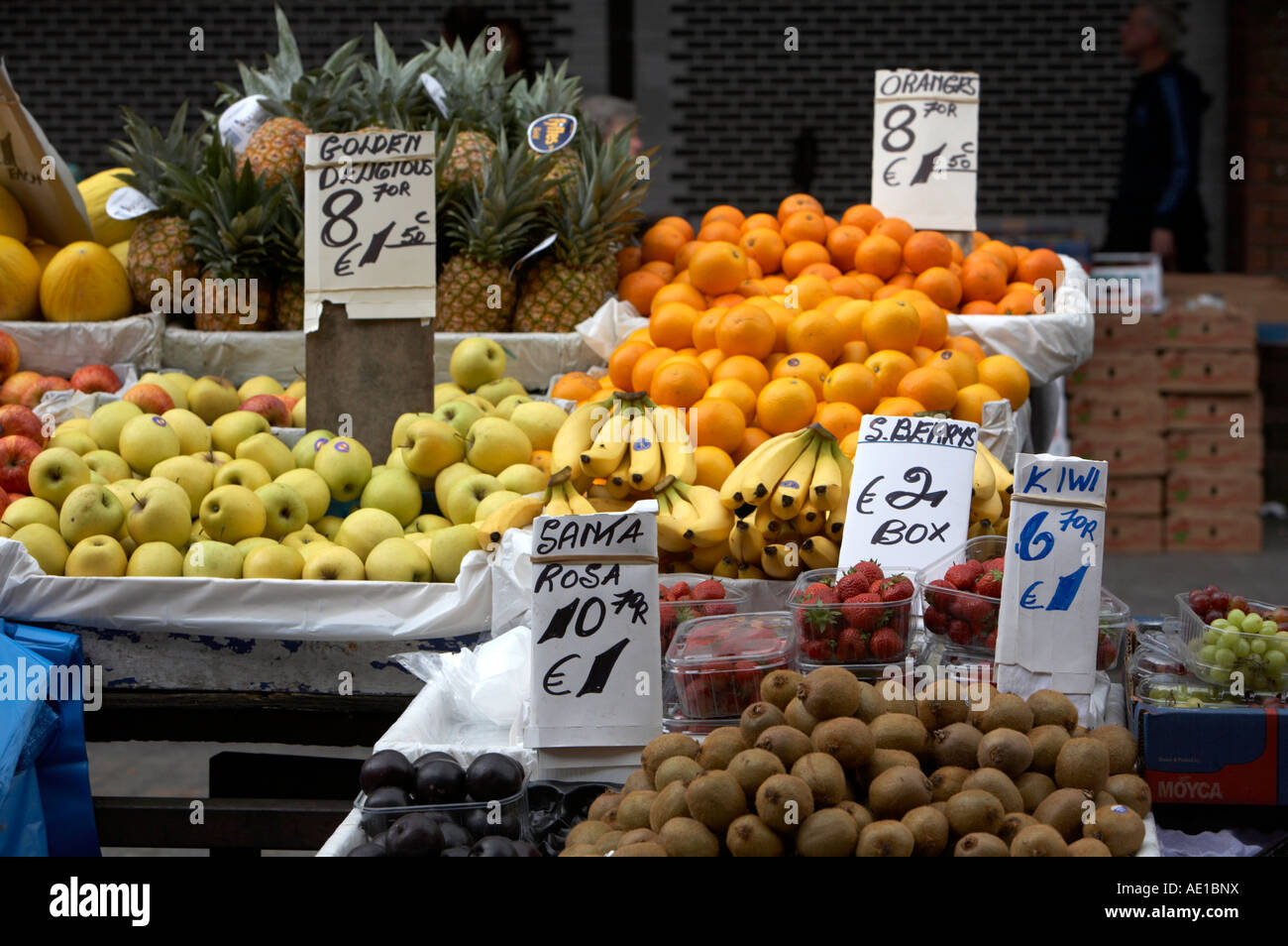 various fruit on fruit stall with signs in english and with euro prices at outdoor fruit market dublin Stock Photo