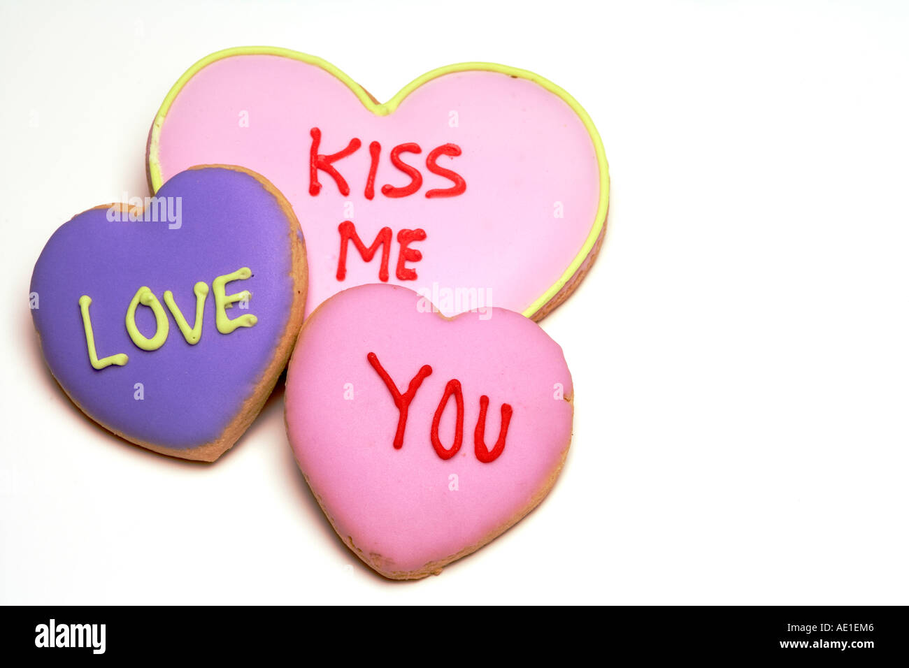 Kiss me, love you valentine cookies against a white background Stock Photo  - Alamy