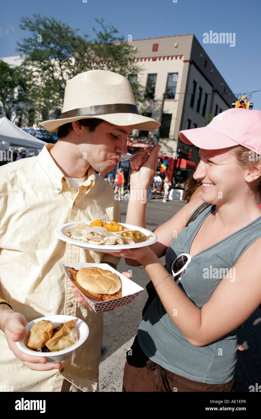 Ann Arbor Michigan,Liberty Street,Art Fairs,happy couple,food,share,sample,MI070719029 Stock Photo