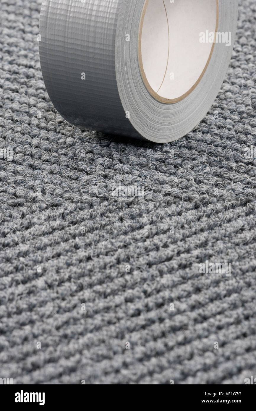 Roll of Gaffer tape on patterned carpet tile floor Stock Photo Alamy