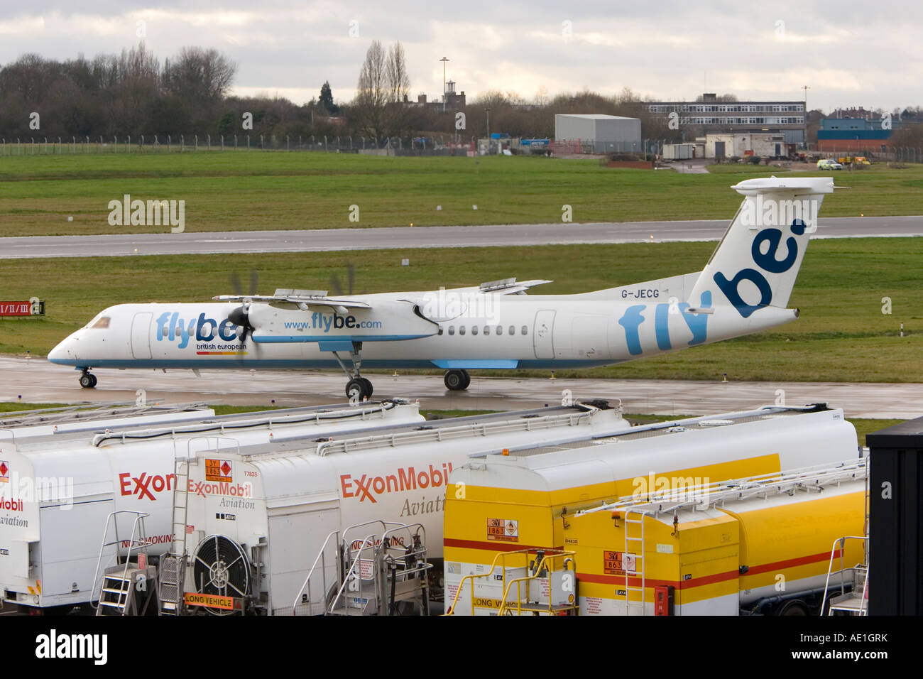 Aeroplane commercial passenger civil aviation Flybe British European Dash 8 at Birmingham airport Stock Photo