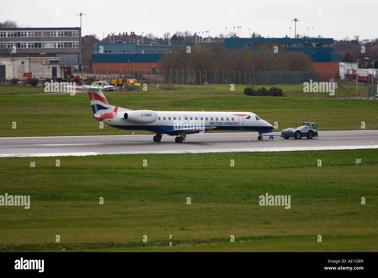 Aeroplane commercial passenger civil aviation British Airways BA Embraer 145 at Birmingham airport Stock Photo