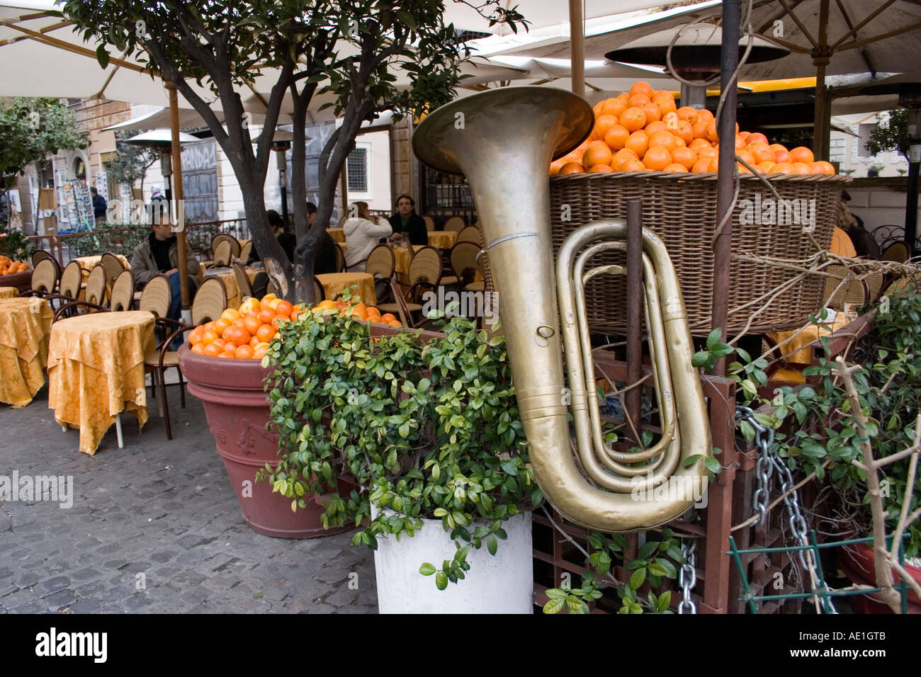 Cafe in Rome Italy with oranges and tuba musical instrument Stock Photo
