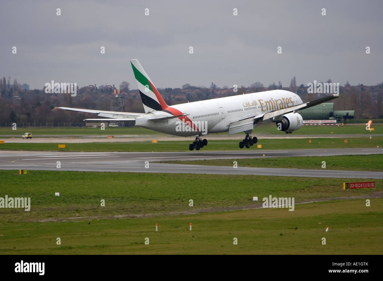 Aeroplane commercial passenger civil aviation Emirates Boeing 777 at Birmingham airport Stock Photo