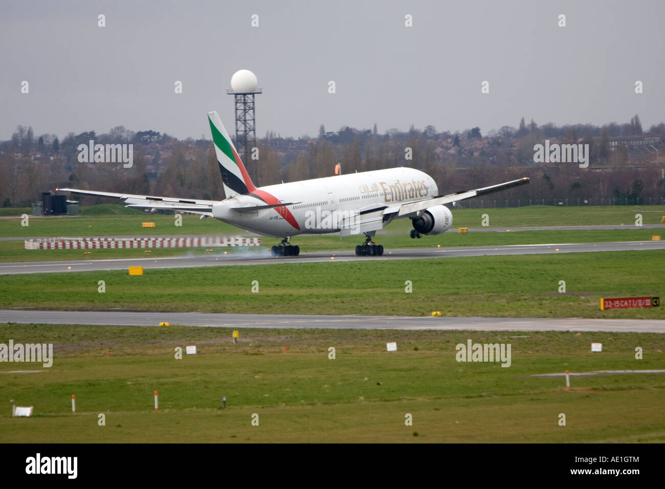 Aeroplane commercial passenger civil aviation Emirates Boeing 777 at Birmingham airport Stock Photo