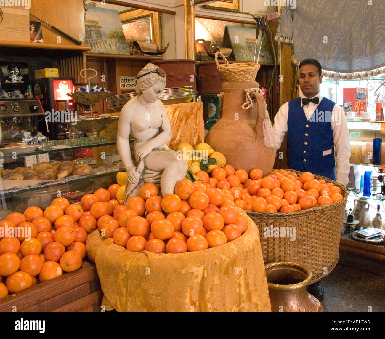 Cafe in Rome Italy with oranges and and waiters in blue uniforms Stock