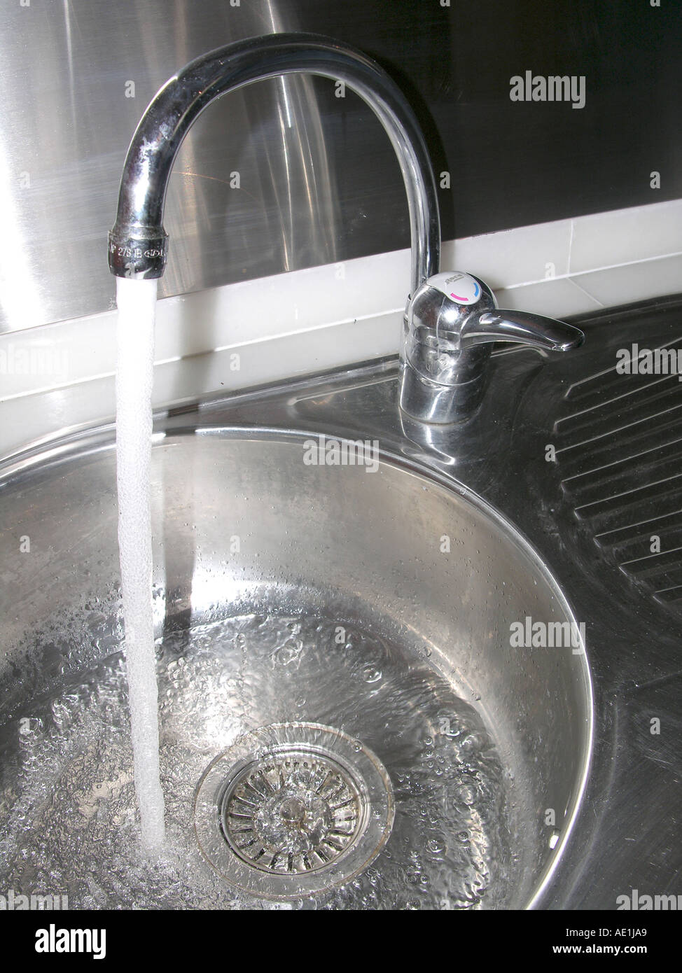 A sink with running water Stock Photo Alamy