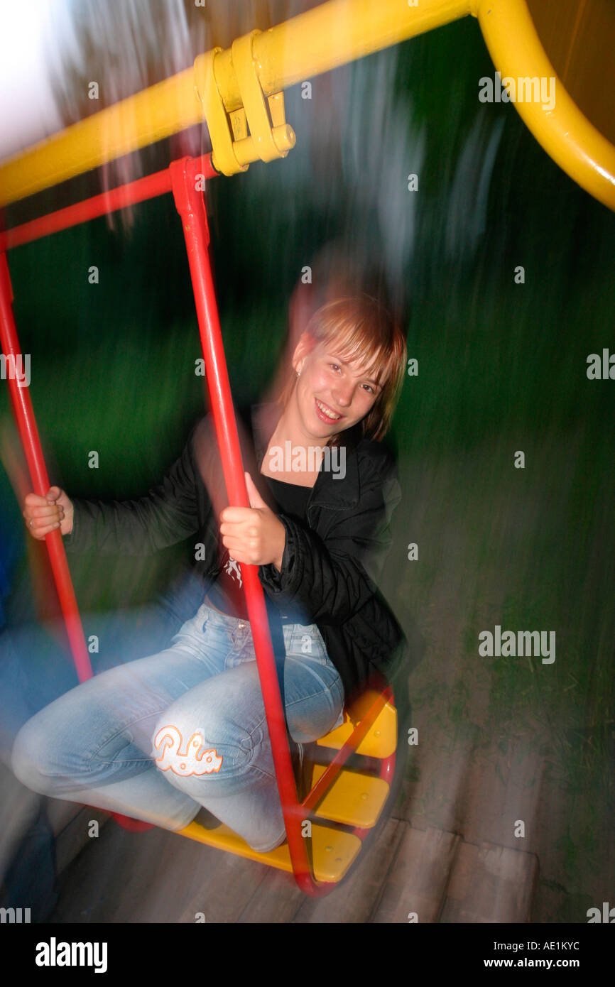 Woman swinging alone back view hi-res stock photography and images - Alamy