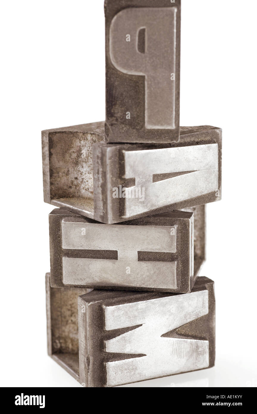 Stack of lead letters on white background Stock Photo - Alamy
