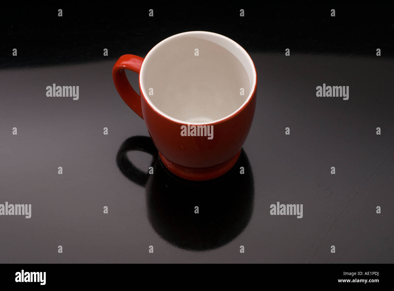 Red coffee cup on black background Stock Photo - Alamy