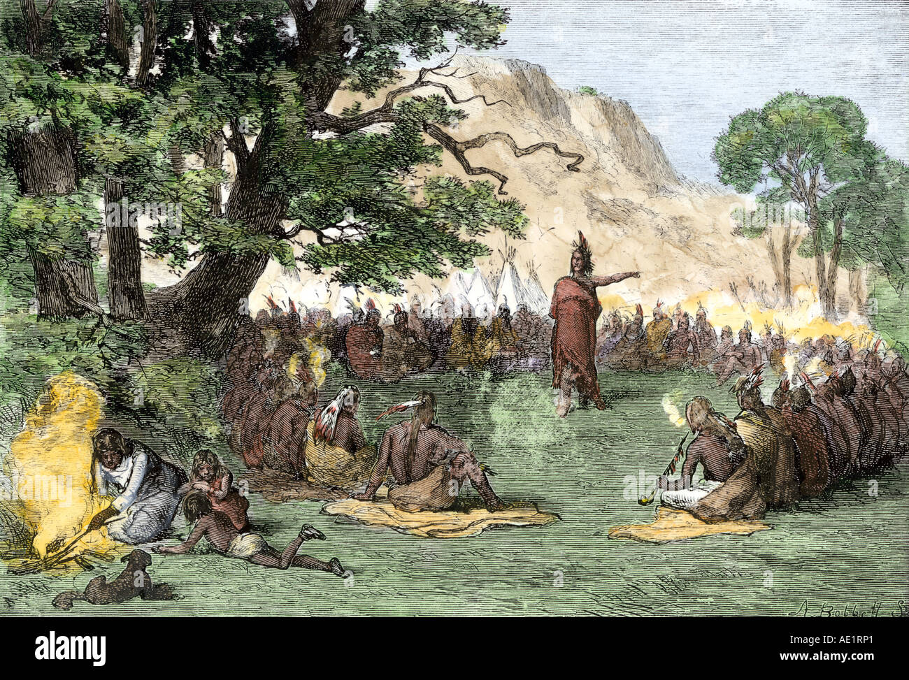 Chief Pontiac addressing a gathering of Native Americans to rally them against the British 1760s. Hand-colored woodcut Stock Photo