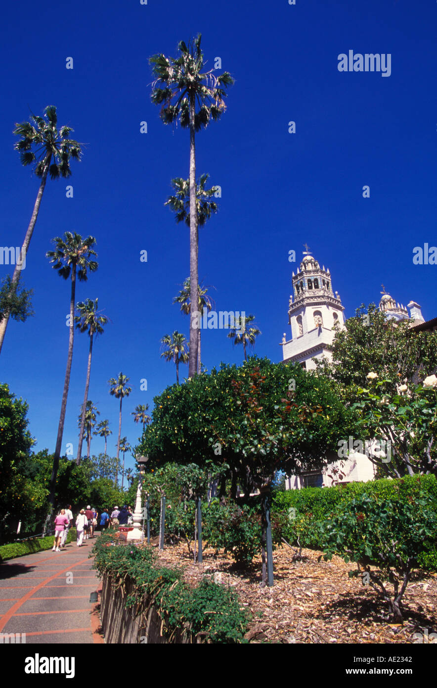 California San Simeon Hearst Castle Casa Grande visitors on guided tour in garden area Stock Photo