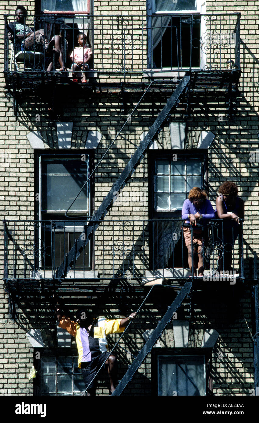 People on a fire escape, Brooklyn New York Stock Photo