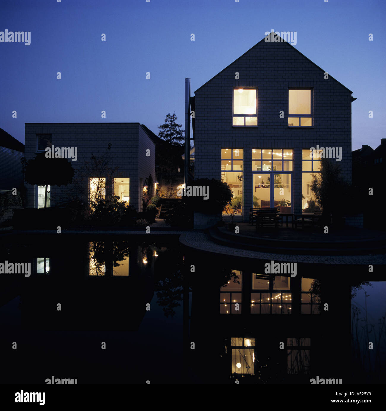 Modern House Exterior at Dusk Stock Photo - Alamy
