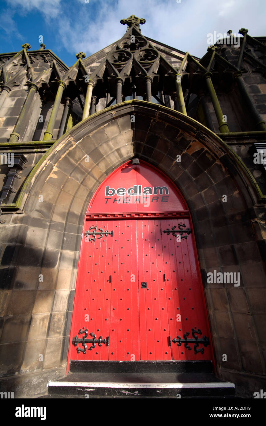 The imposing red painted door main entrance of the Bedlam Theatre on Bristo Place in Edinburgh Scotland UK May 2006 Stock Photo