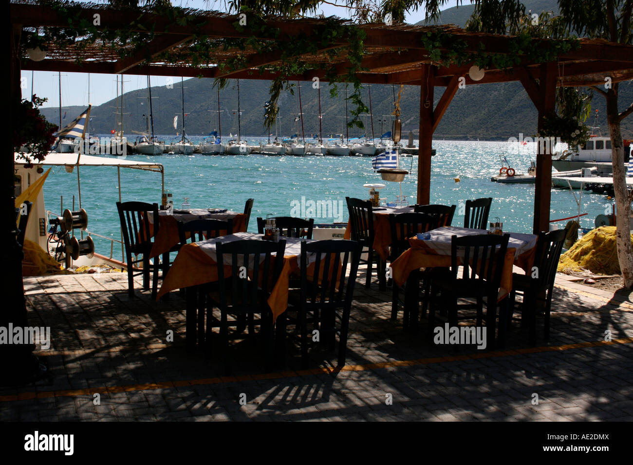 Outdoor restaurant in the harbour bay Vasiliki Lefkas Greece Stock