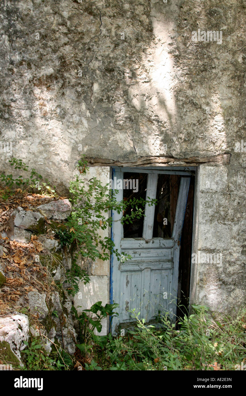 Broken Door Hanging From Its Hinges Of Old Cottage Nidri Lefkas